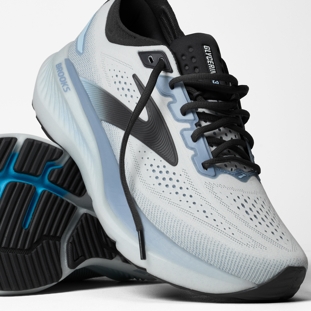 White running shoe with black and blue accents on a white background